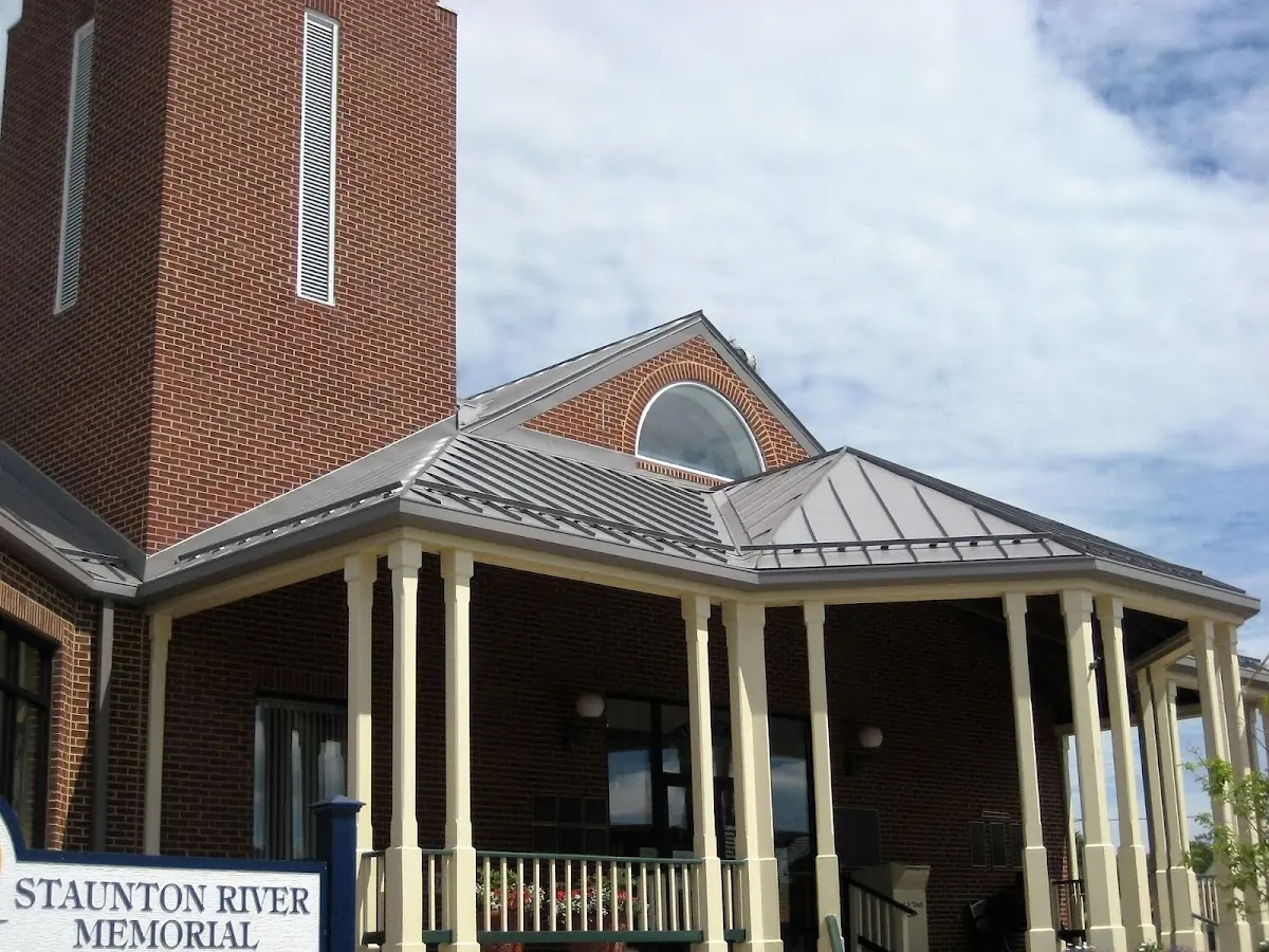 Skilled roofing craftsmen working on a residential roof in Dover